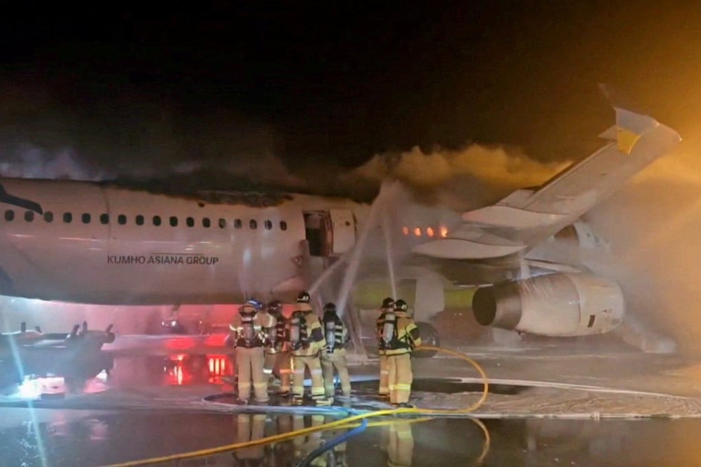 Firefighters try to put out the blaze from an Air Busan plane at Gimhae International Airport in South Korea on January 28. Photo: Yonhap/Reuters