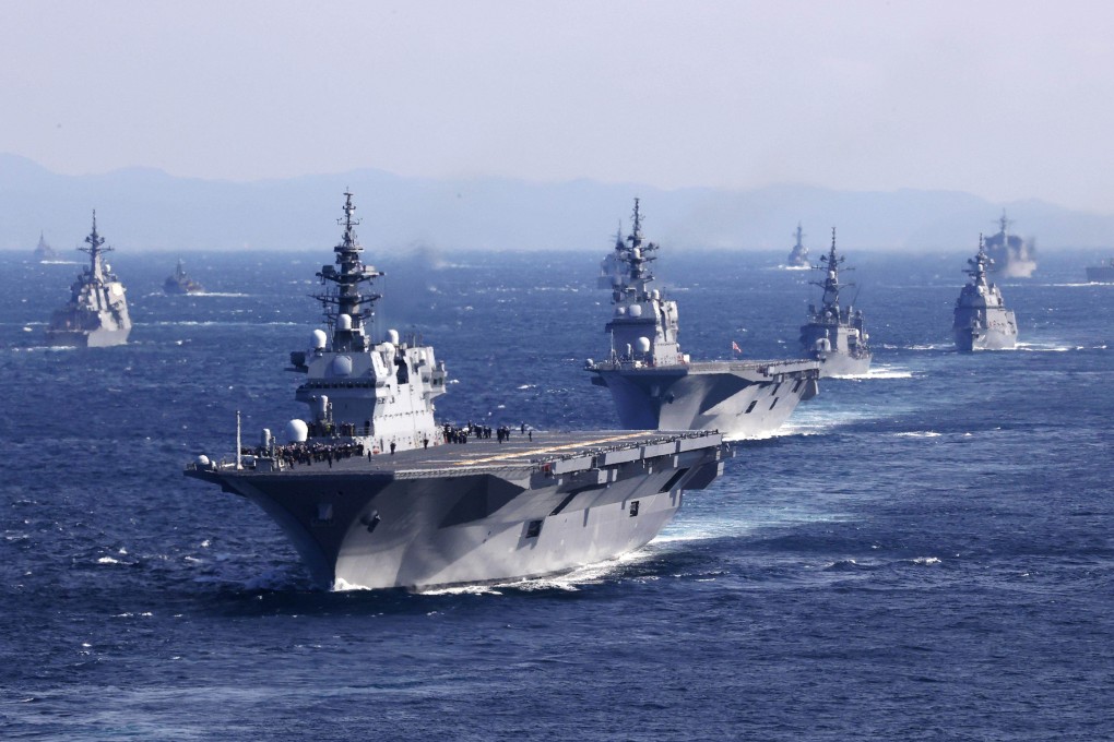Japan’s Maritime Self-Defence Force helicopter carrier JS Izumo, in the foreground, and other warships join an international fleet review in Sagami Bay, south of Tokyo, on November 6, 2022. Photo: Kyodo News