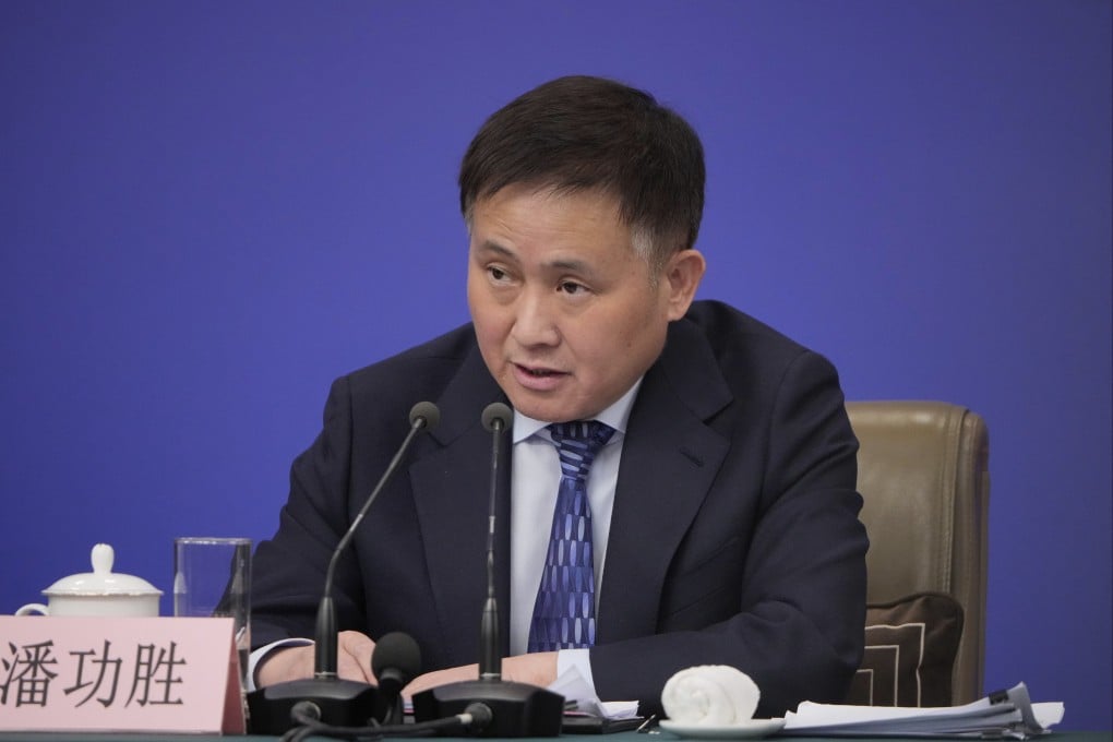 Pan Gongsheng, governor of the People’s Bank of China, speaks during a press conference in March. Photo: AP