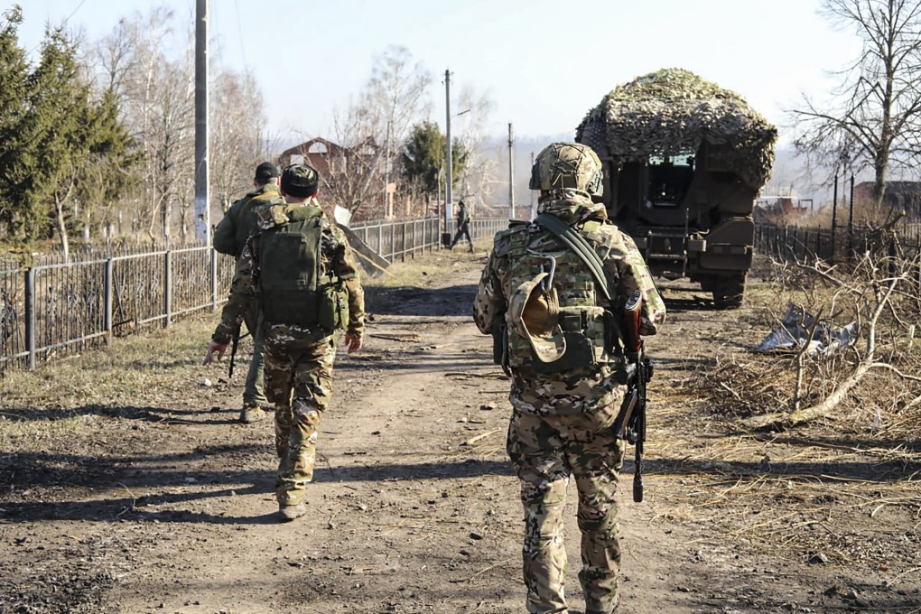 Russian troops walk at an area in the Kursk region on Friday. Photo: EPA-EFE