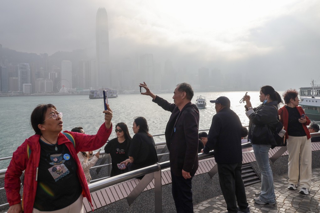 Tourists visit Victoria Harbour in Tsim Sha Tsui. Photo: Dickson Lee
