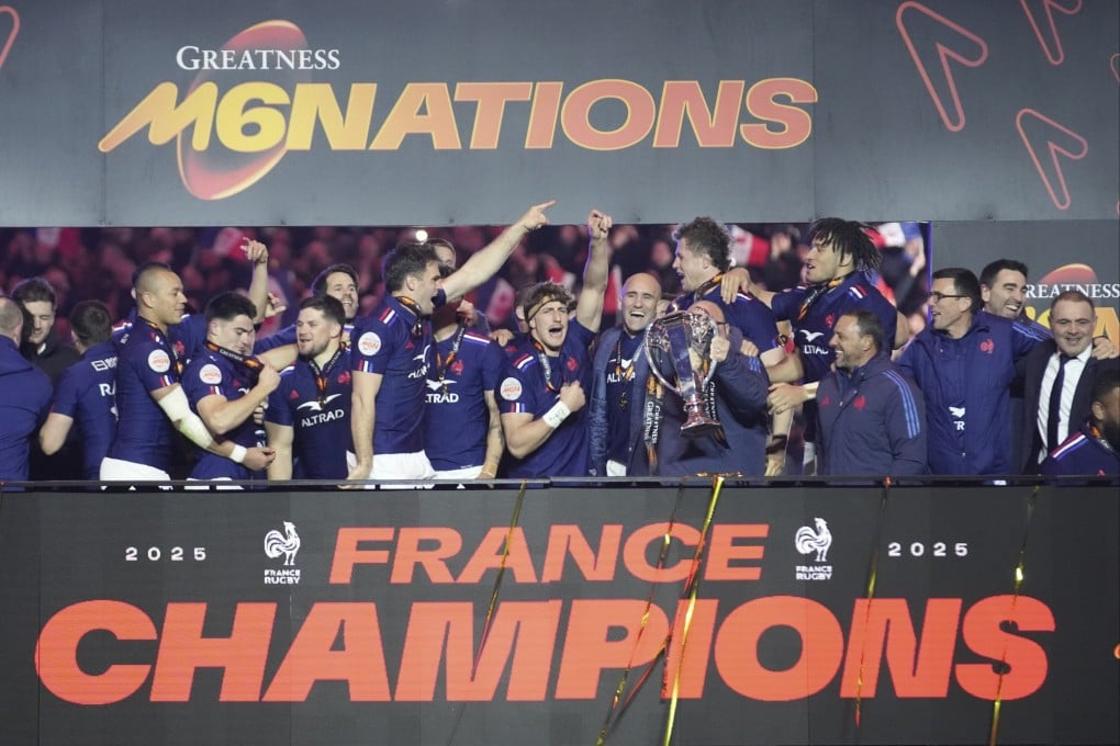 The French team celebrate with the trophy after clinching the Six Nations championship with victory over Scotland. Photo: AP