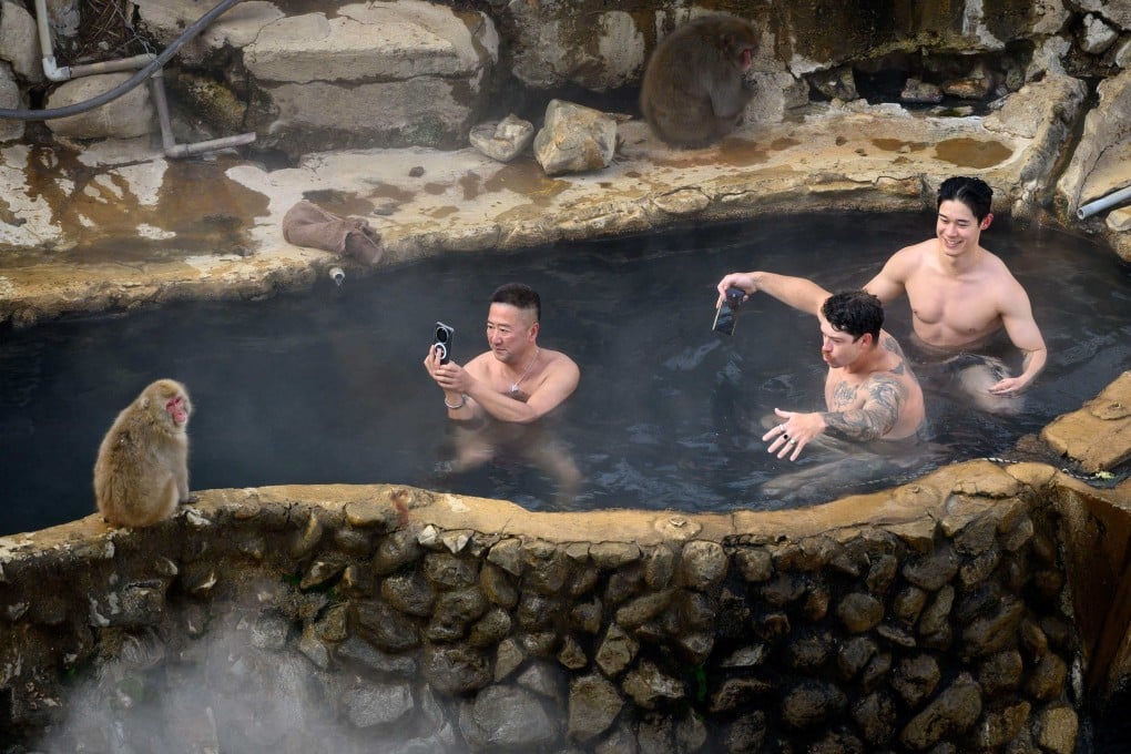 Guests take an open-air hot spring bath in Yamanouchi, Japan’s Nagano prefecture. Photo: AFP