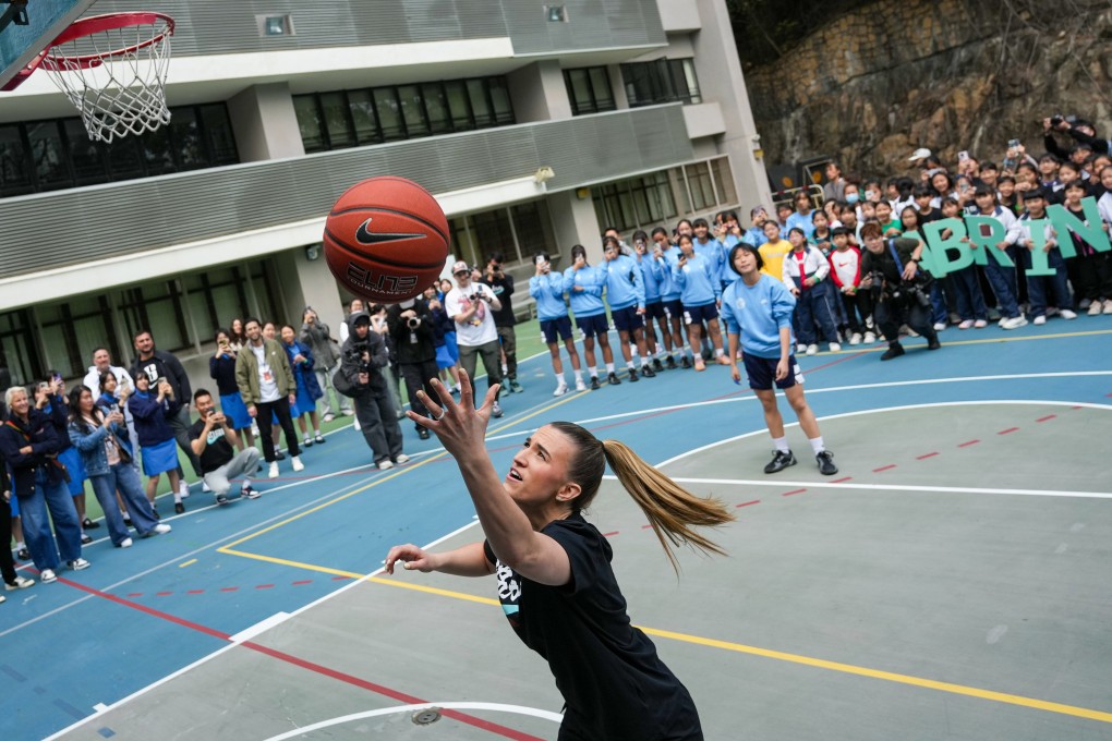 Heep Yunn School pupils watch on as WNBA star Sabrina Ionescu runs through some drills. Photo: Eugene Lee