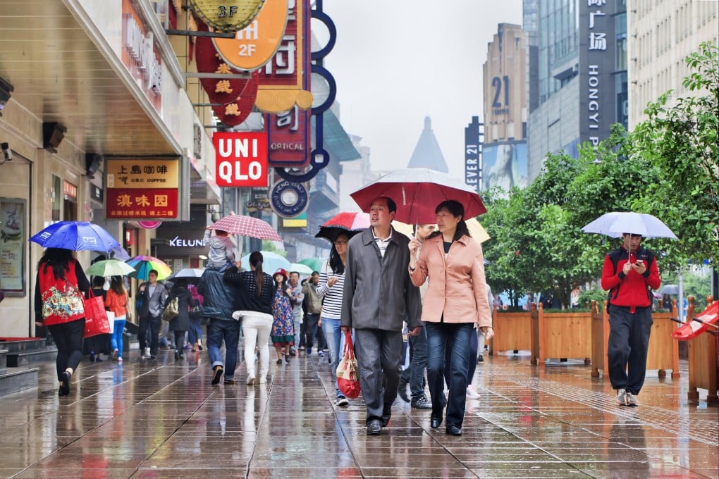 Shoppers walk along Nanjing Road in central Shanghai. China is striving to boost consumption amid a slowing economy. Photo: Shutterstock