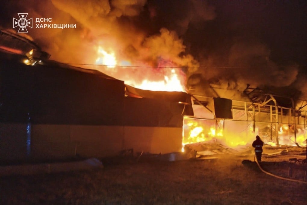 Ukrainian firefighters at a storehouse struck by a Russian attack in Chuhuiv, near Kharkiv, on Monday. Photo: Ukrainian Emergency Service via AP