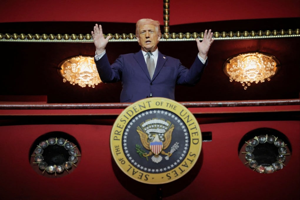 US President Donald Trump gestures while he poses for a picture at the presidential box at the John F Kennedy Centre for the Performing Arts in Washington on Monday. Photo: Reuters