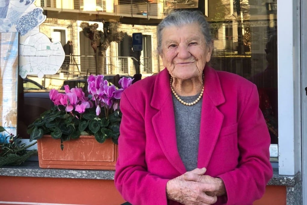 Anna Possi, 100, outside her cafe Bar Centrale in Nebbiuno, in northern Italy, where she has been serving coffee every day for 67 years. Photo: courtesy of Anna Possi