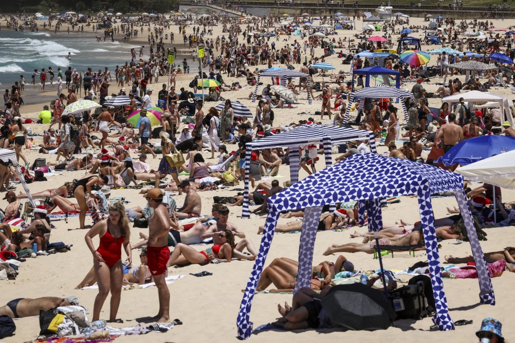 Sun seekers pack out Sydney’s Bondi Beach in December. Each year between 2003 and 2018, an average of 49,483 years of healthy life were lost in Australia to cardiovascular disease caused by hot weather. Photo: AFP