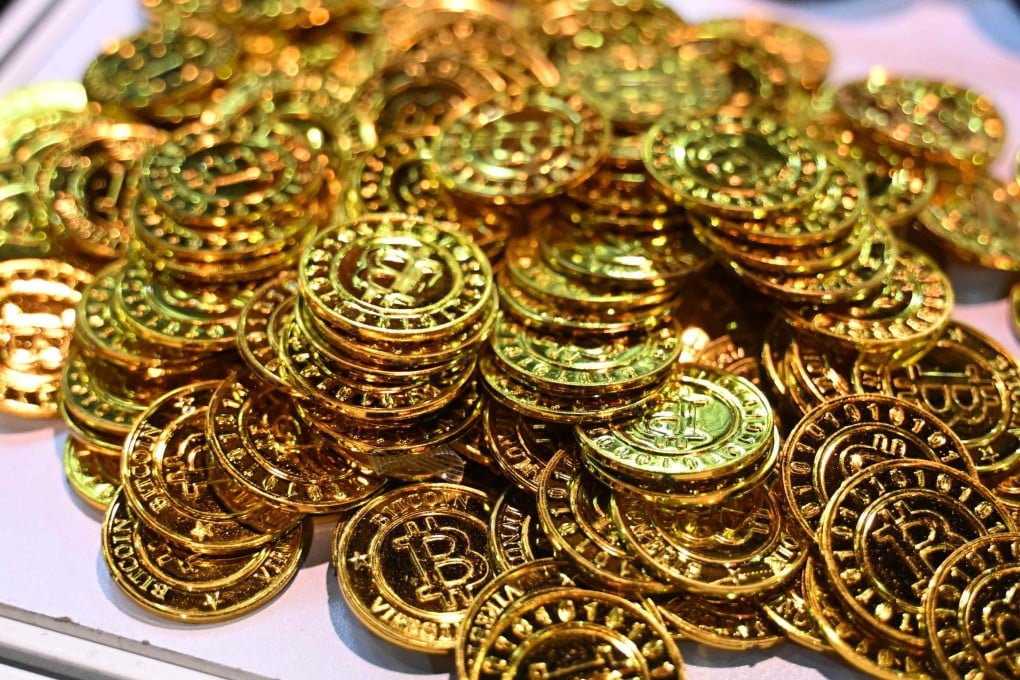 Souvenir tokens representing bitcoin are seen at an industry event in Hong Kong. Photo: AFP