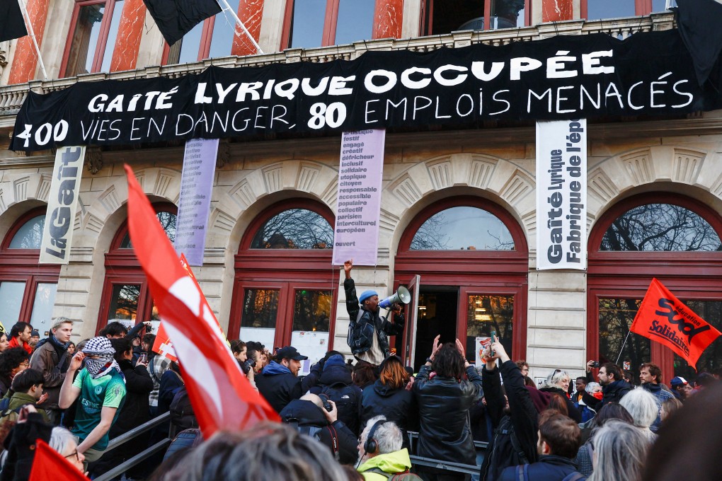 People gather in front of the Gaite Lyrique theatre against the police eviction of hundreds of migrants from the theatre, in Paris. Photo: Reuters