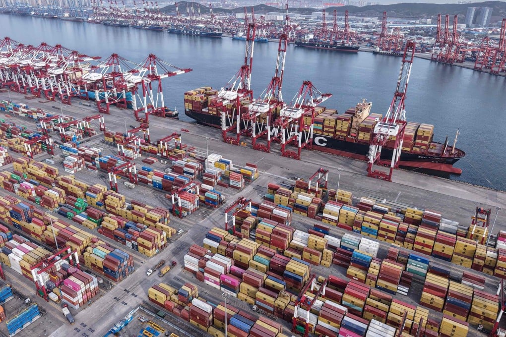 Container ships at a port in Qingdao, Shandong province. The OECD has concluded US tariffs will slow China’s economic growth in 2025 and 2026. Photo: AFP