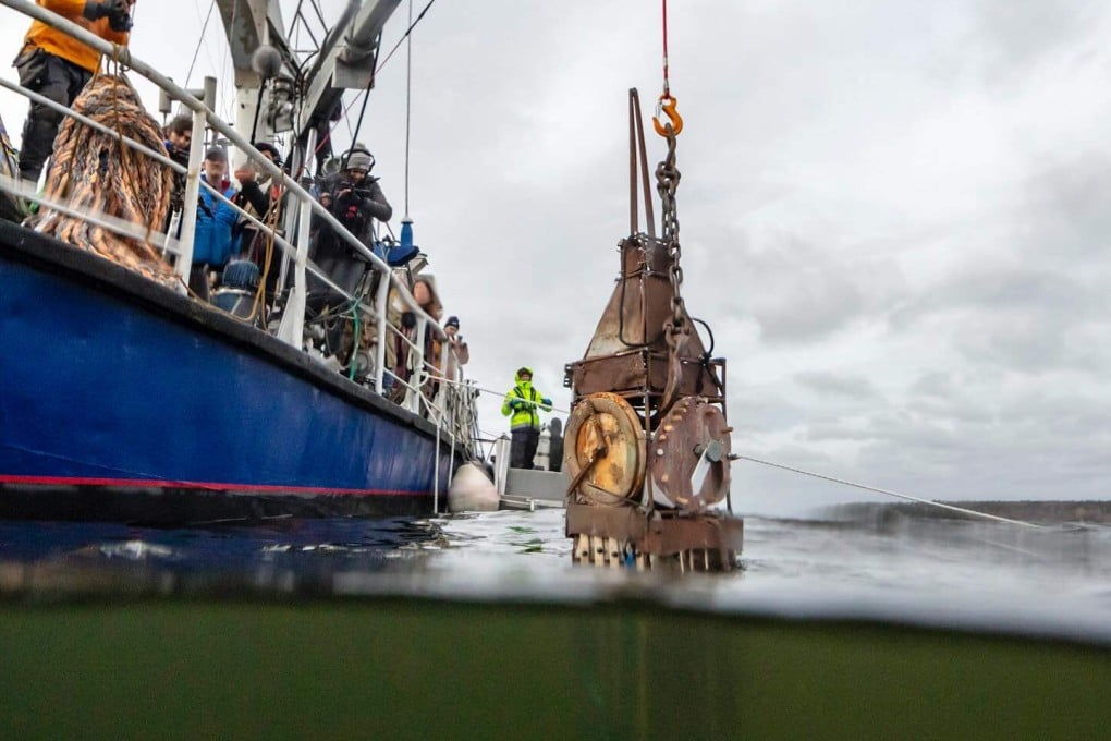 A model of London’s Big Ben made of scrap recovered from the sea around Stockholm, Sweden, by Hands2Ocean is lowered into position for the group’s underwater art show, “Atlantis”. Photo: Instagram/hands2ocean