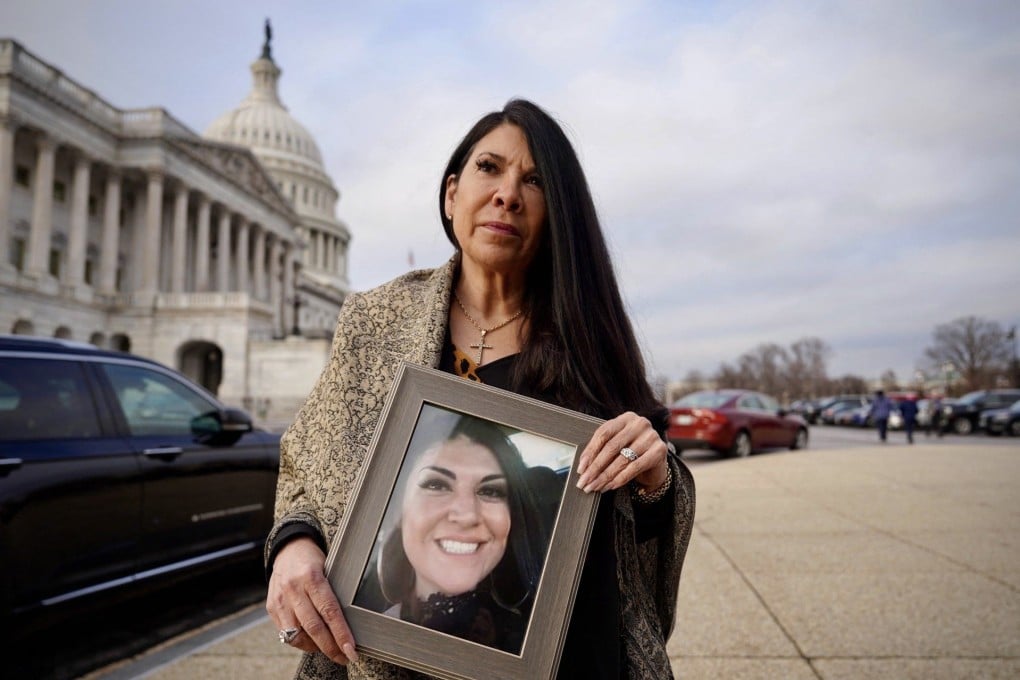 Andrea Thomas, executive director of Facing Fentanyl, poses on Capitol Hill on February 6 with a portrait of her daughter Ashley Romero, who died in 2018 after taking a counterfeit painkiller laced with fentanyl. Photo: AFP