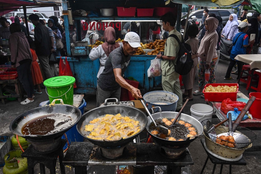 A man cooks tempeh, which is made from fermented soybeans, in Surabaya, Indonesia, earlier this month. Photo: AFP