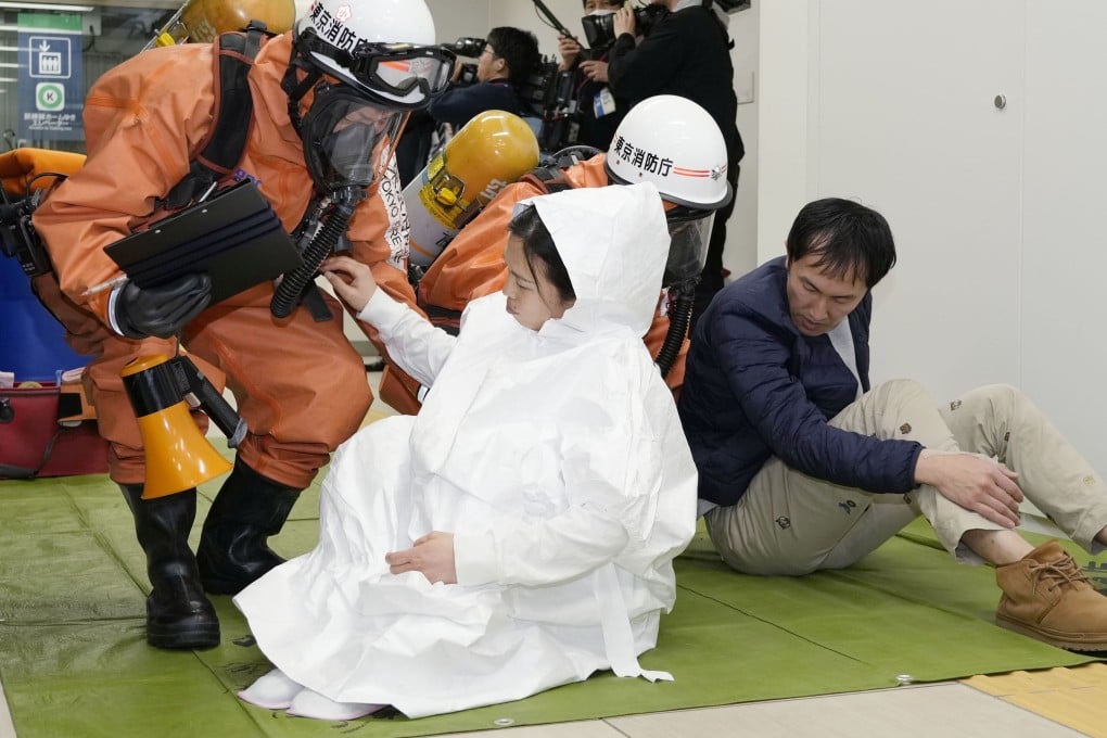 An anti-terrorist drill is conducted at a Tokyo Metro facility on Friday, ahead of the 30th anniversary of the Aum Shinrikyo cult’s sarin nerve gas attack. Photo: Kyodo