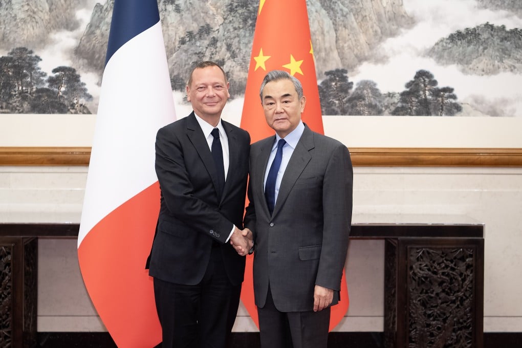 Foreign Minister Wang Yi (right) and French diplomatic adviser Emmanuel Bonne (left) meet in Beijing in December. The two senior diplomats held a call on Tuesday to discuss the Ukraine war. Photo: Xinhua