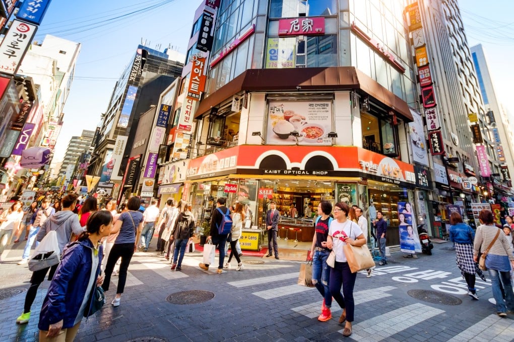 People walking through Seoul’s Myeong-Dong shopping street. Photo: Shutterstock