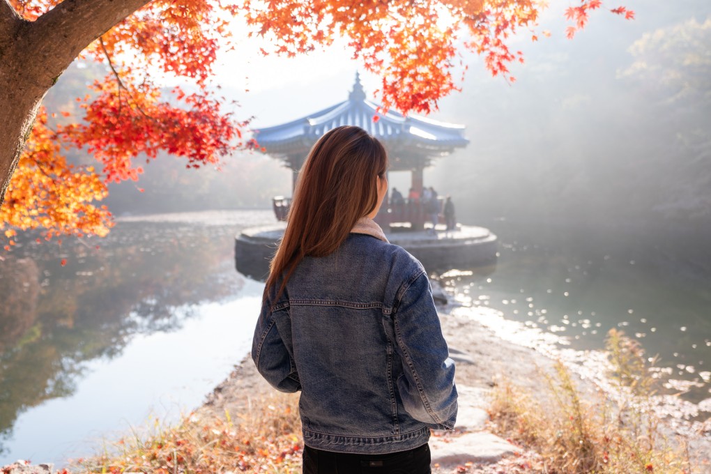 A woman at Naejangsan National Park in South Korea. South Korean women are choosing to stay single over getting married. Photo: Getty Images