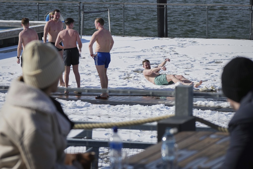 People enjoy a sunny and frosty day after sweating in the sauna of the public bath in Helsinki, Finland. Photo: AP