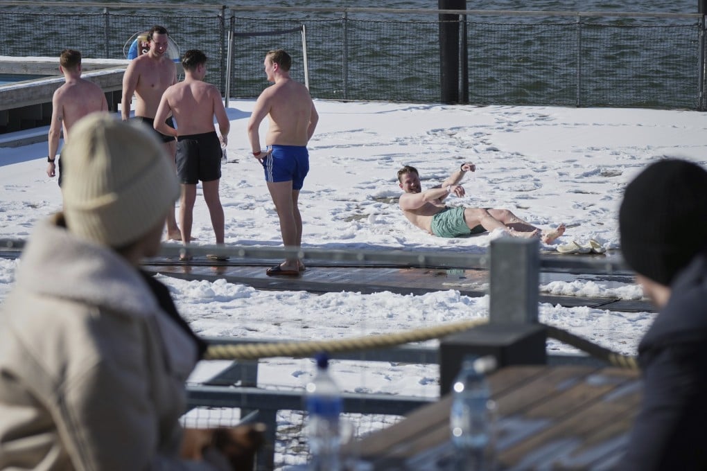 People enjoy a sunny and frosty day after sweating in the sauna of the public bath in Helsinki, Finland. Photo: AP