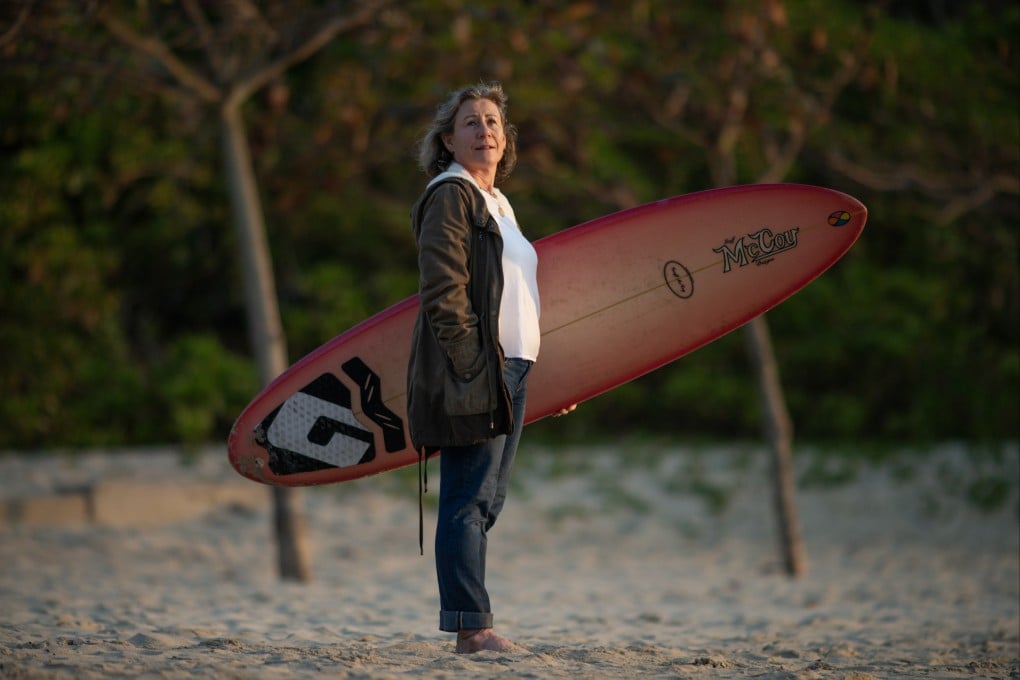 Hong Kong-based researcher Dr JudIth Blaine on the beach in Big Wave Bay, Hong Kong, in January 2025. A surfer herself, Blaine recently delved into the relationship between surfing and mental well-being. Photo: Antony Dickson