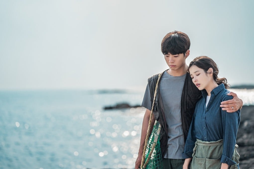 Park Bo-gum as Yang Gwan-sik (left) and IU as Oh Ae-sun in a still from Netflix K-drama When Life Gives You Tangerines. Photo: Netflix