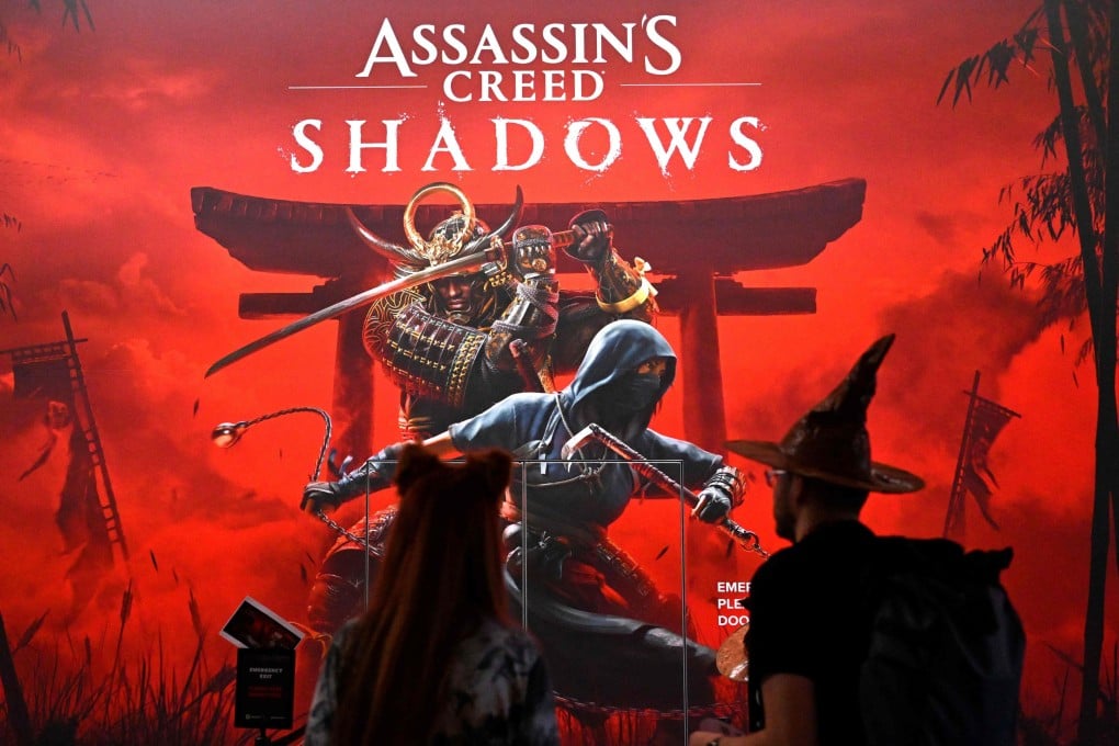 Visitors stand at the ‘Assassin’s Creed Shadows’ video game booth at the Gamescom video games trade fair in Cologne, Germany in August 2024. Photo: AFP