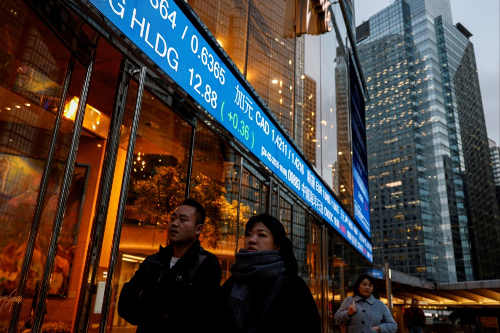Stock prices are displayed outside Exchange Square in Hong Kong. Photo: Reuters