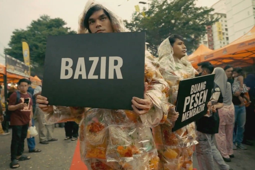 Volunteer models wearing suits filled with discarded food hold up placards urging the public to reduce food wastage during the launch of MySaveFood’s #BazirRamadan campaign in Kuala Lumpur last week. Photo: MySaveFood