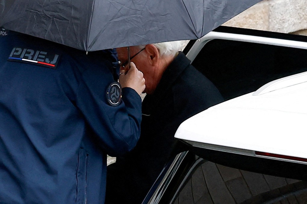 Prison officers escort ex-surgeon Joel Le Scouarnec from a car during his trial in Vannes, Brittany, France. Photo: Reuters