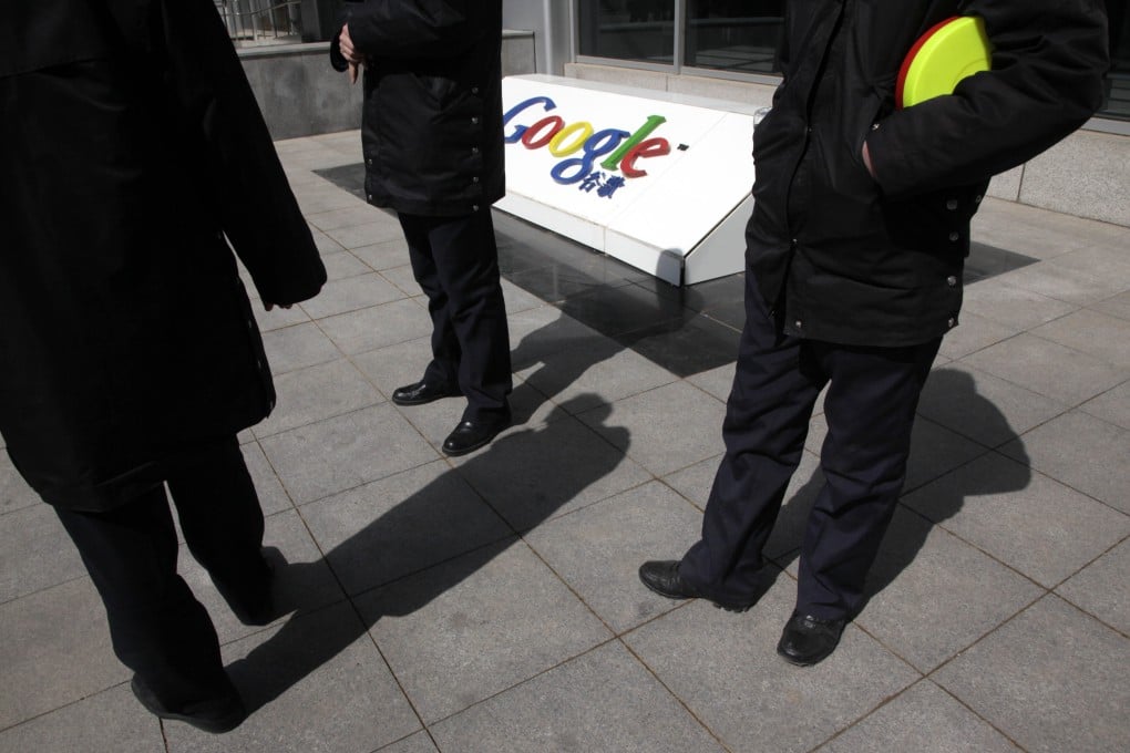 Security guards stand near the Google logo outside the Google China headquarters in Beijing, China, on March 23, 2010. China’s government reacted testily to Google Inc.’s decision to stop censoring its China-based search engine, calling the move “totally wrong” and accusing the company of violating promises. Photo: AP