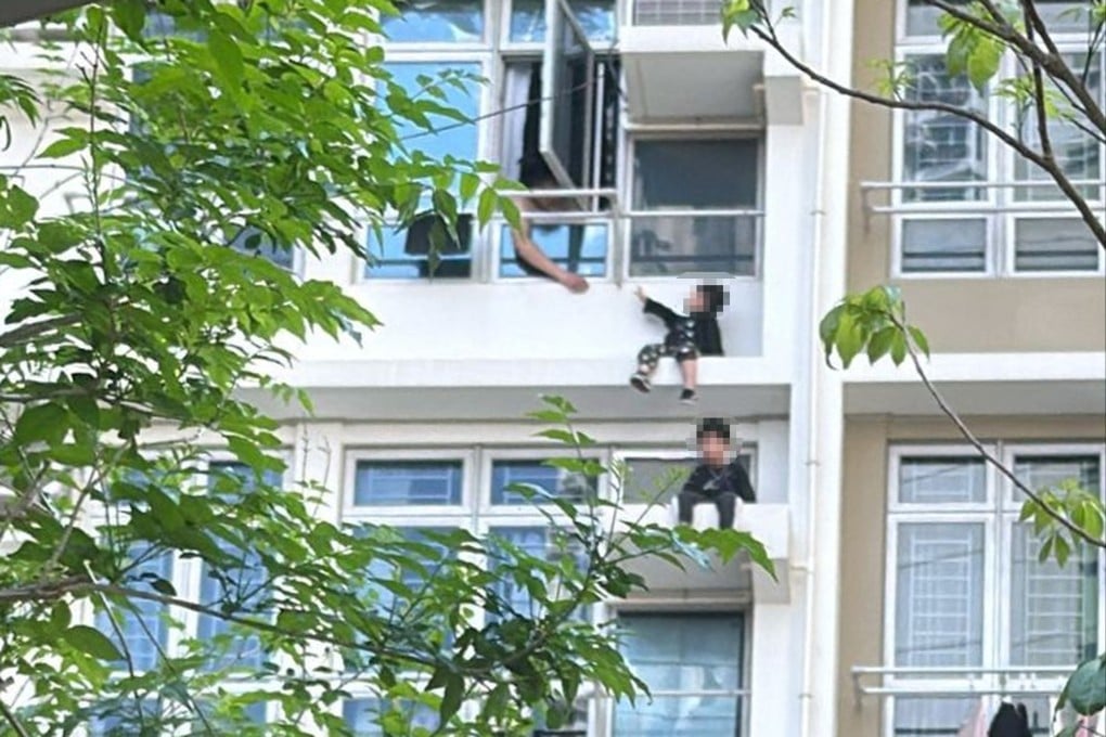 The two children became trapped outside the window and were discovered by passers-by who alerted the emergency services. Photo: Desmond Wang/Facebook