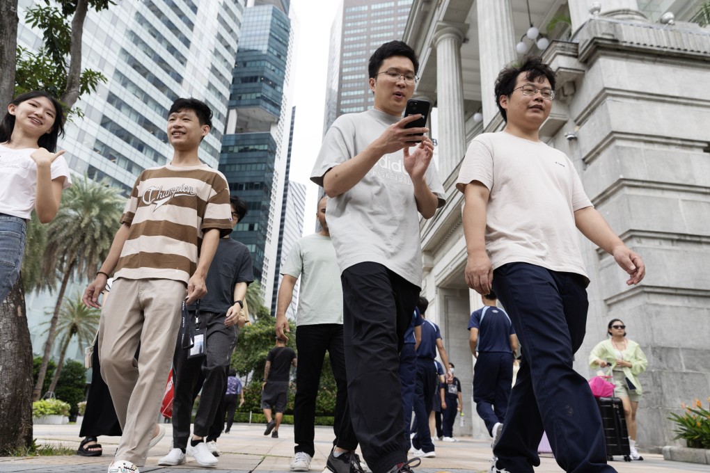 People walk in the Central Business District in Singapore. Photo: EPA-EFE