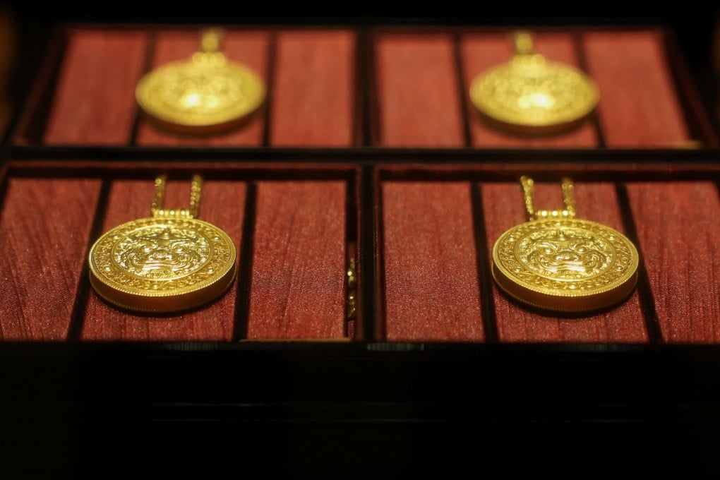 Gold necklaces sit in a display case at a Laopu Gold jewellery store in Beijing. Chinese jewellers have struggled to threaten global luxury players – until now. Photo: Reuters