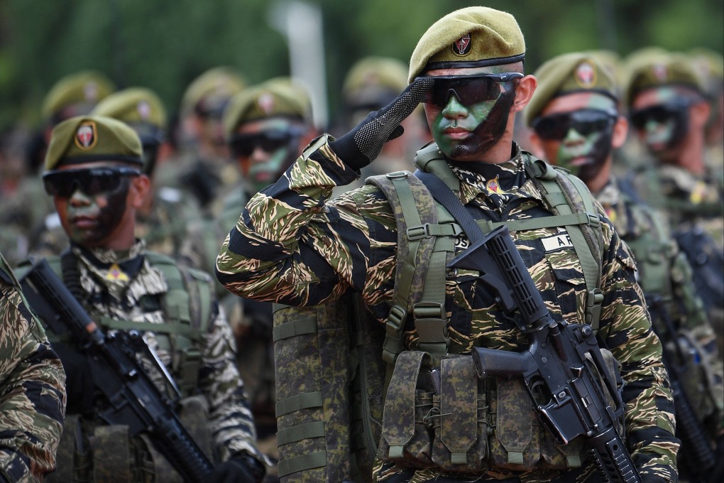 Soldiers march during a military parade held to mark the 89th founding anniversary of the Armed Forces of the Philippines in December 2024. Photo: AFP