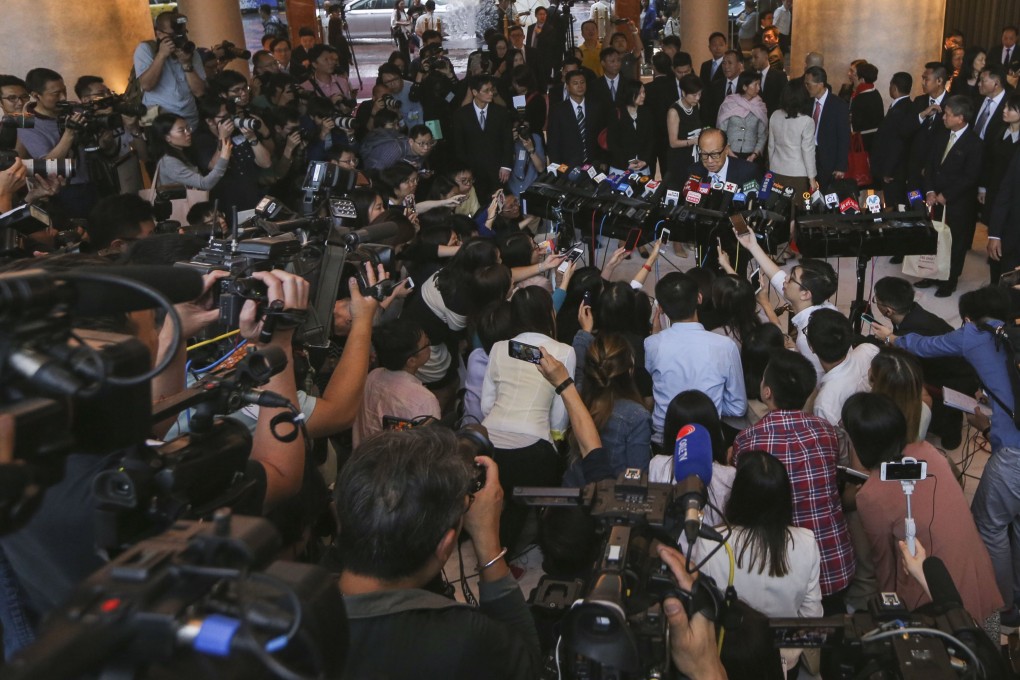 Li Ka-shing (centre) during his final annual general meeting as the chairman of his flagship companies CK Hutchison Holdings and CK Asset Holdings in Hung Hom on 10 May 2018, before his retirement. Photo: Sam Tsang