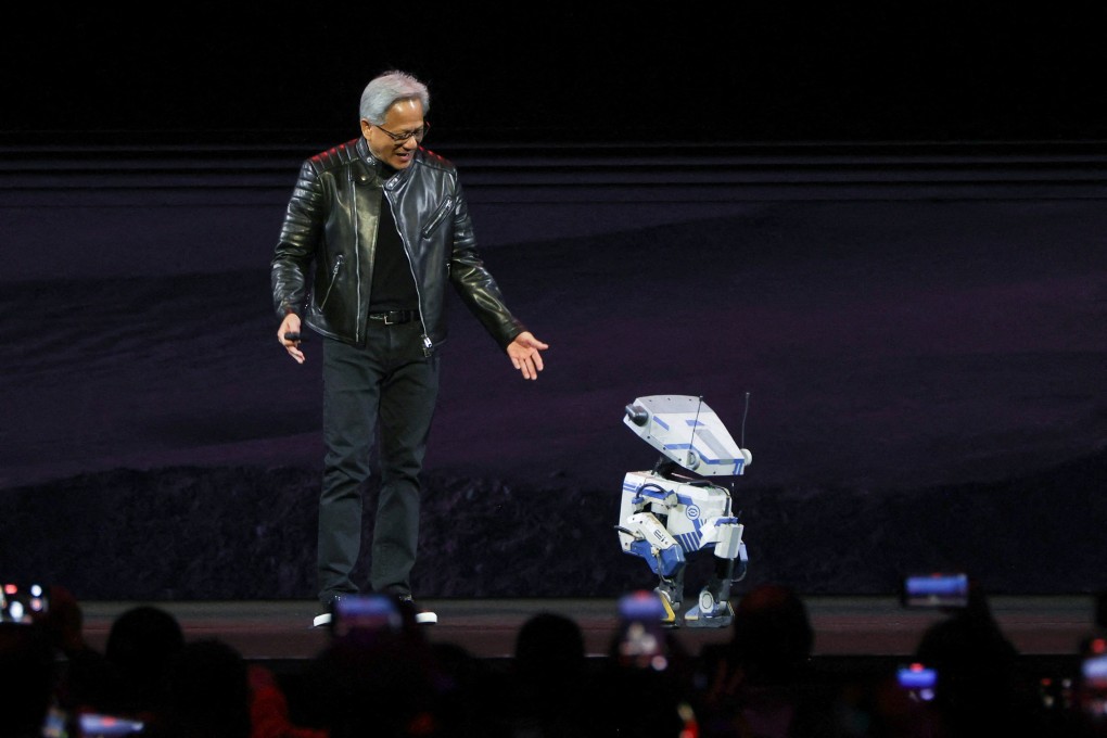 Nvidia CEO Jensen Huang interacts with a small robot on stage during the keynote for the Nvidia GPU Technology Conference (GTC) at the SAP Centre in San Jose, California on Thursday. Photo: Reuters