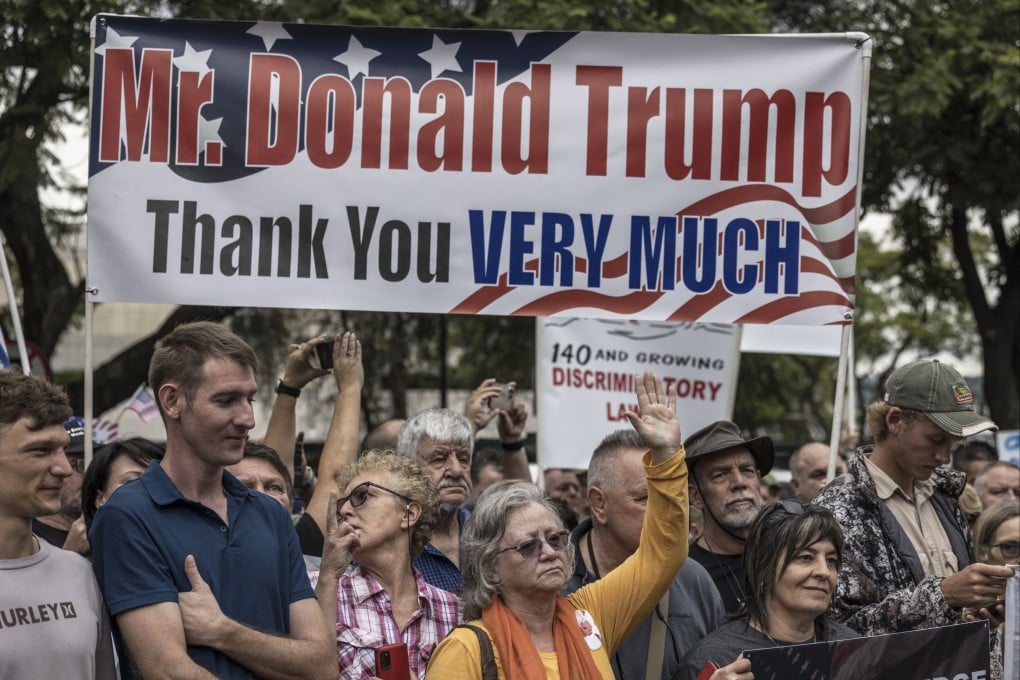 White South Africans supporting US President Donald Trump gather in front of the US embassy in Pretoria on February 15. Photo: AFP
