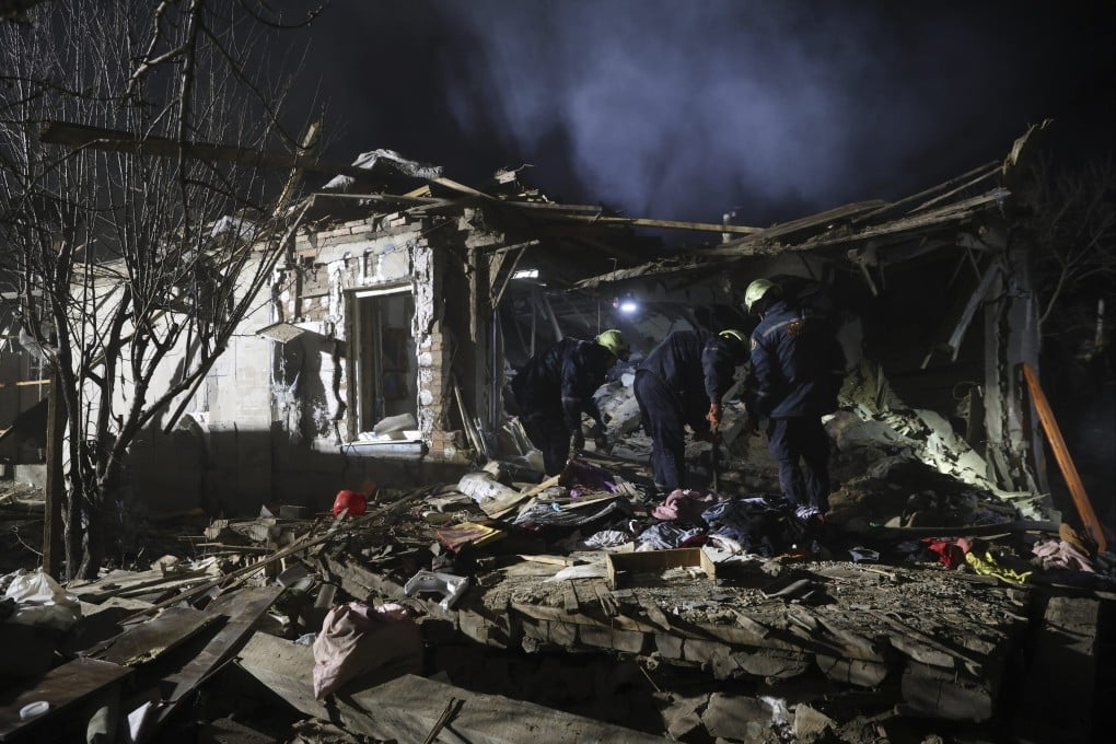 Rescue workers clear the rubble of a residential house destroyed by a Russian drone strike in Zaporizhzhia on Friday. Photo:AP