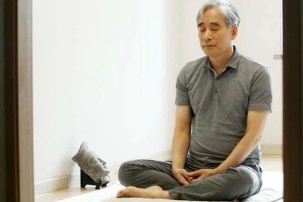 Jeon Hyun-soo, a psychiatrist in South Korea, meditates in a room next to his clinic. He studied Buddhism, was ordained as a monk, and prescribes Buddhist meditation to patients. Photo: courtesy of Jeon Hyun-soo