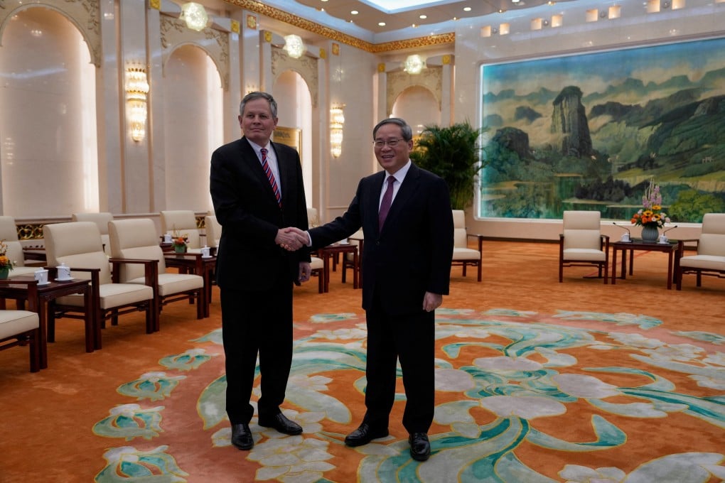 Chinese Premier Li Qiang greets US Senator Steve Daines ahead of their meeting, at the Great Hall of the People in Beijing on March 23. Photo: Pool via Reuters