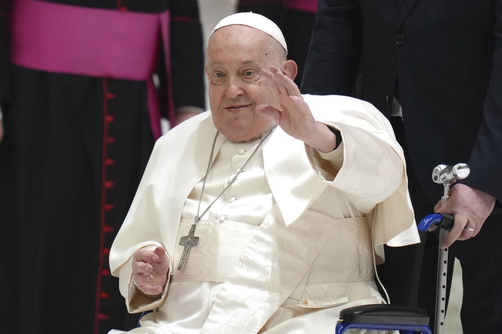 Pope Francis waves as he arrives for his weekly general audience at the Vatican in February. Photo: AP