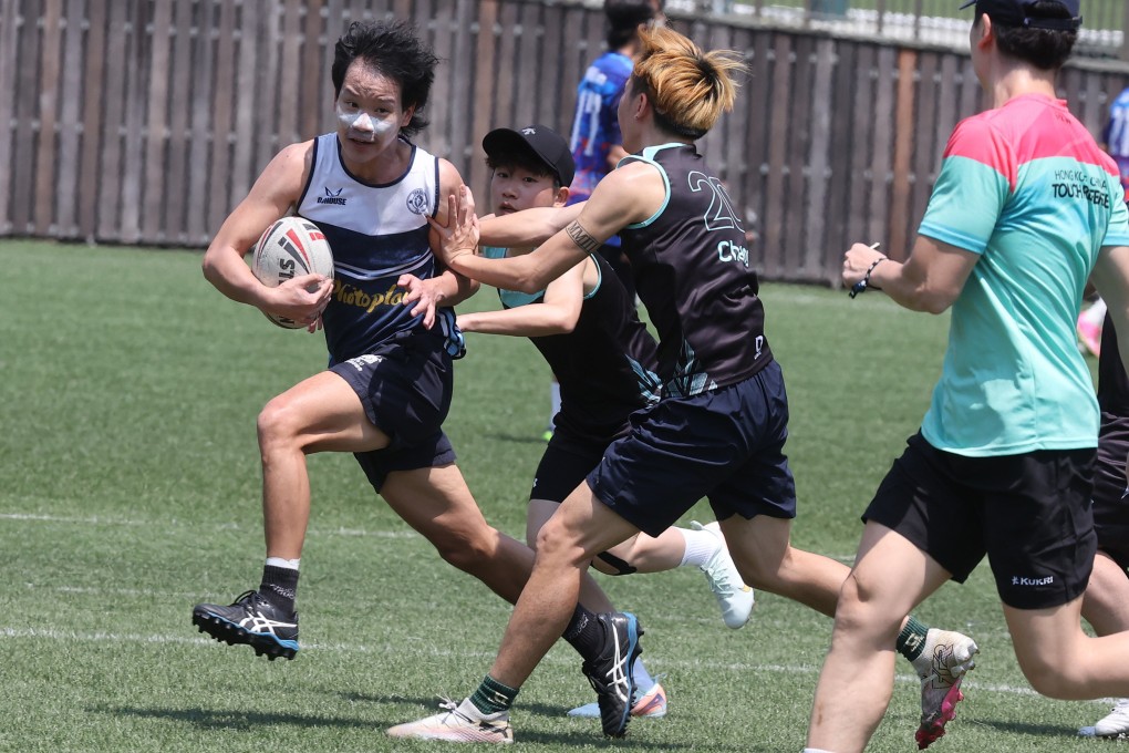 Zion’s Wong Man-chung clings to possession during a game against Galaxy China. Photo: Edmond So