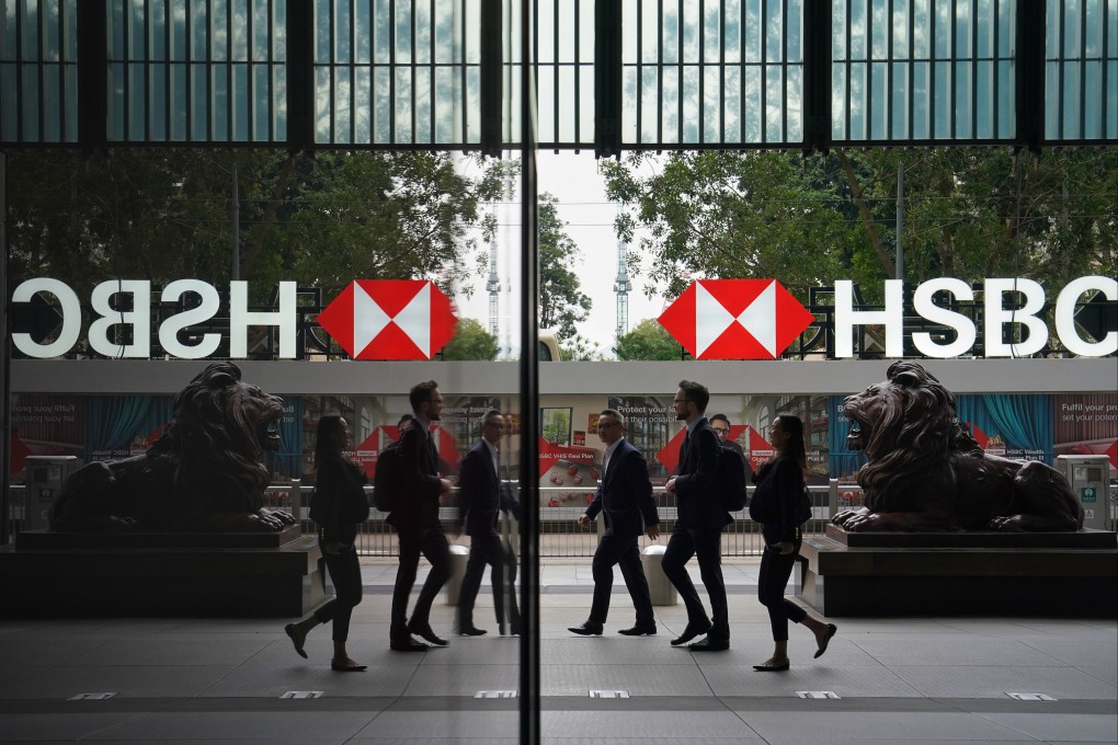 Office workers seen outside HSBC’s head office building in Central, Hong Kong. Photo: Elson Li