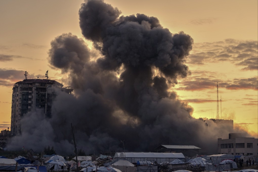 Smoke rises from a building after it was targeted by an Israeli air strike in Gaza City on March 22. Photo: AP