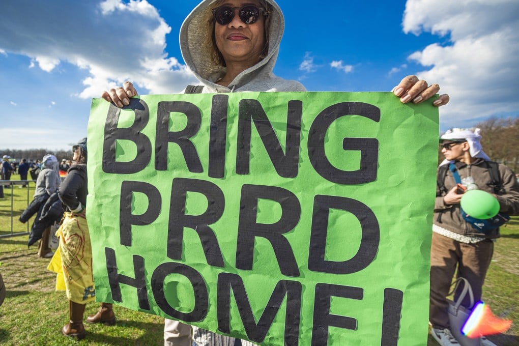 A supporter of Rodrigo Duterte holds a placard during a demonstration in support of the Philippines ex-president in The Hague on Sunday. Photo: dpa