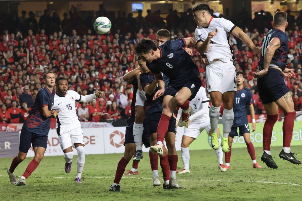 Leon Jones aims a header towards goal during Hong Kong’s victory over Guam last December. Photo: Dickson Lee