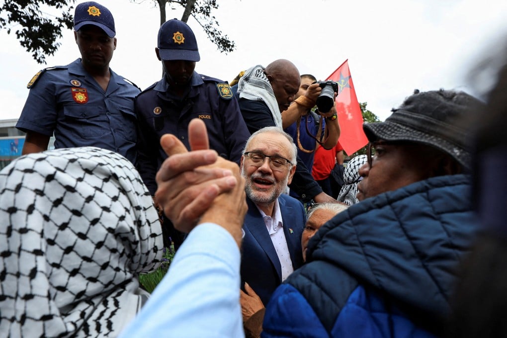 Ebrahim Rasool being greeted upon his arrival at Cape Town International Airport. Photo: Reuters