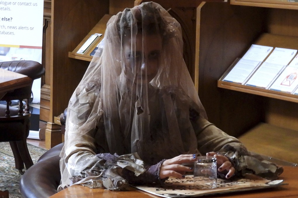 A tour guide retells the haunted history of New Zealand’s parliament library in Wellington on Thursday. Photo: AP